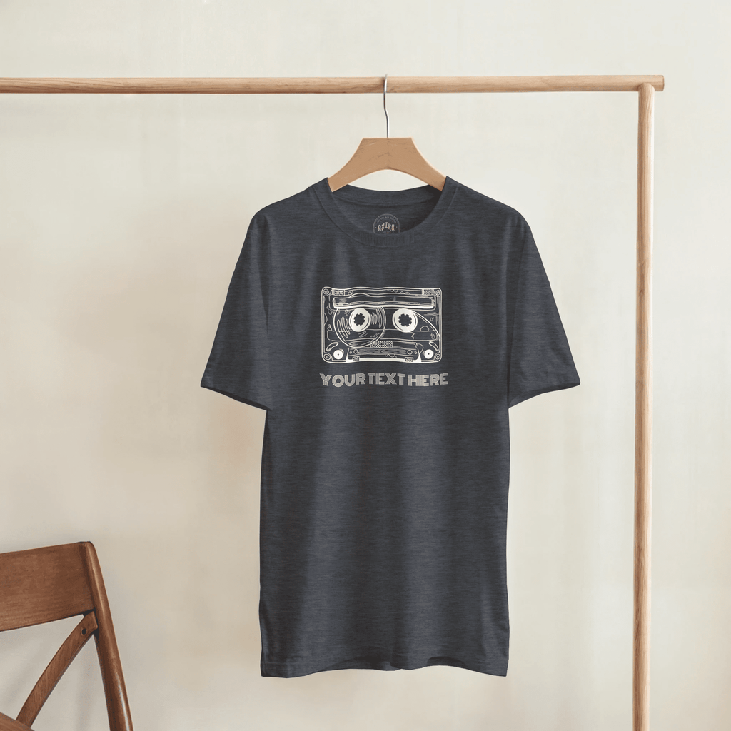 Heather charcoal T-shirt with a retro cassette and sample text “YOUR TEXT HERE”, front view.
